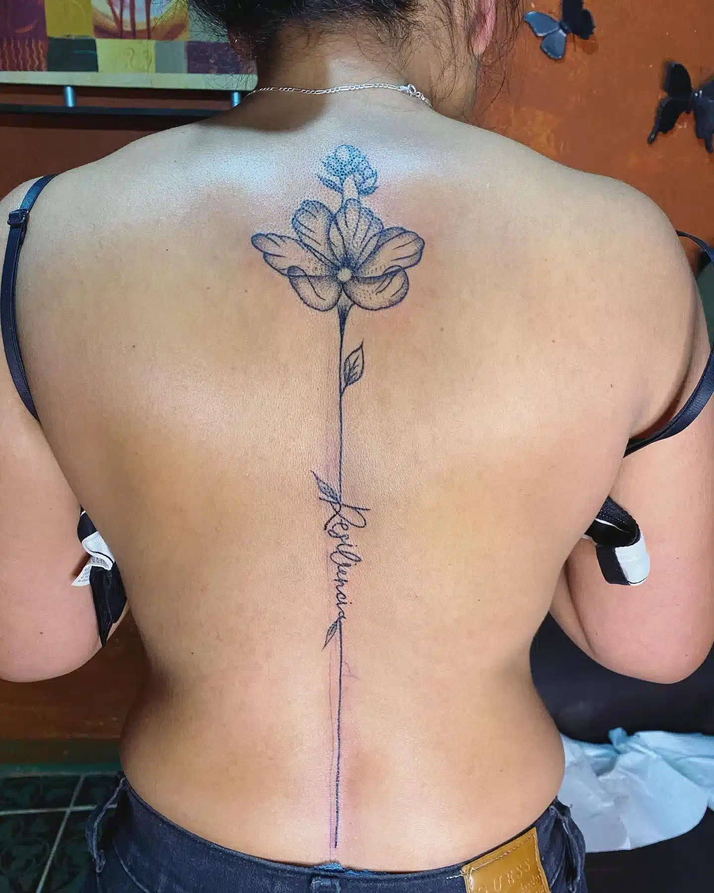 tattoo across the upper spine