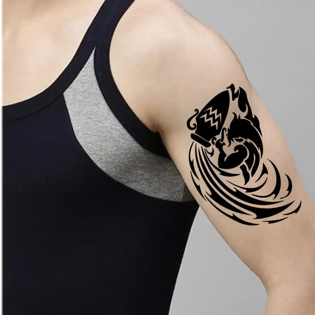 Aquarius tattoo on the shoulder