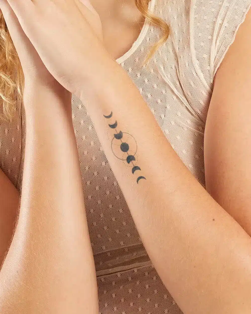 Horizontal moon phases tattoo