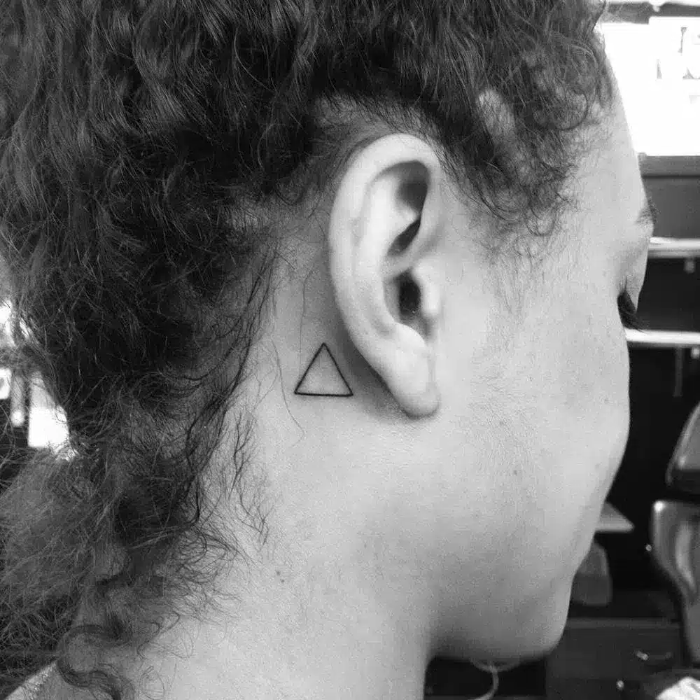 Simple outlined triangle behind the ear