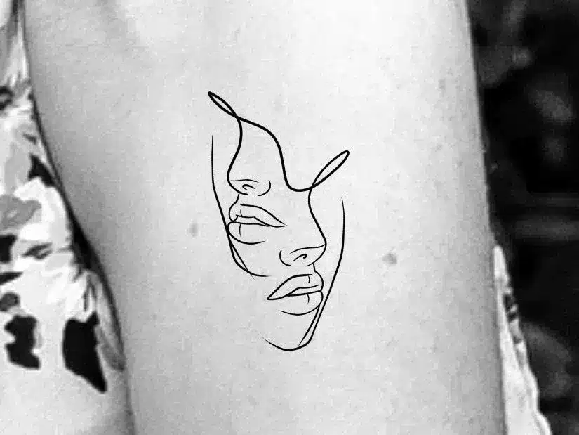 face in profile tattoo