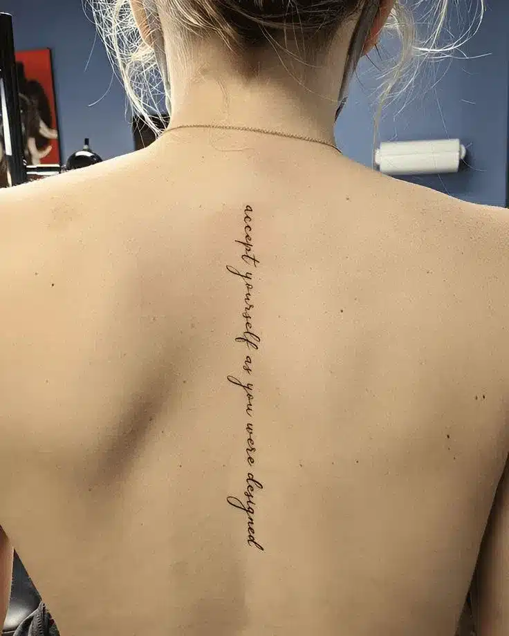 fine-line cursive tattoo