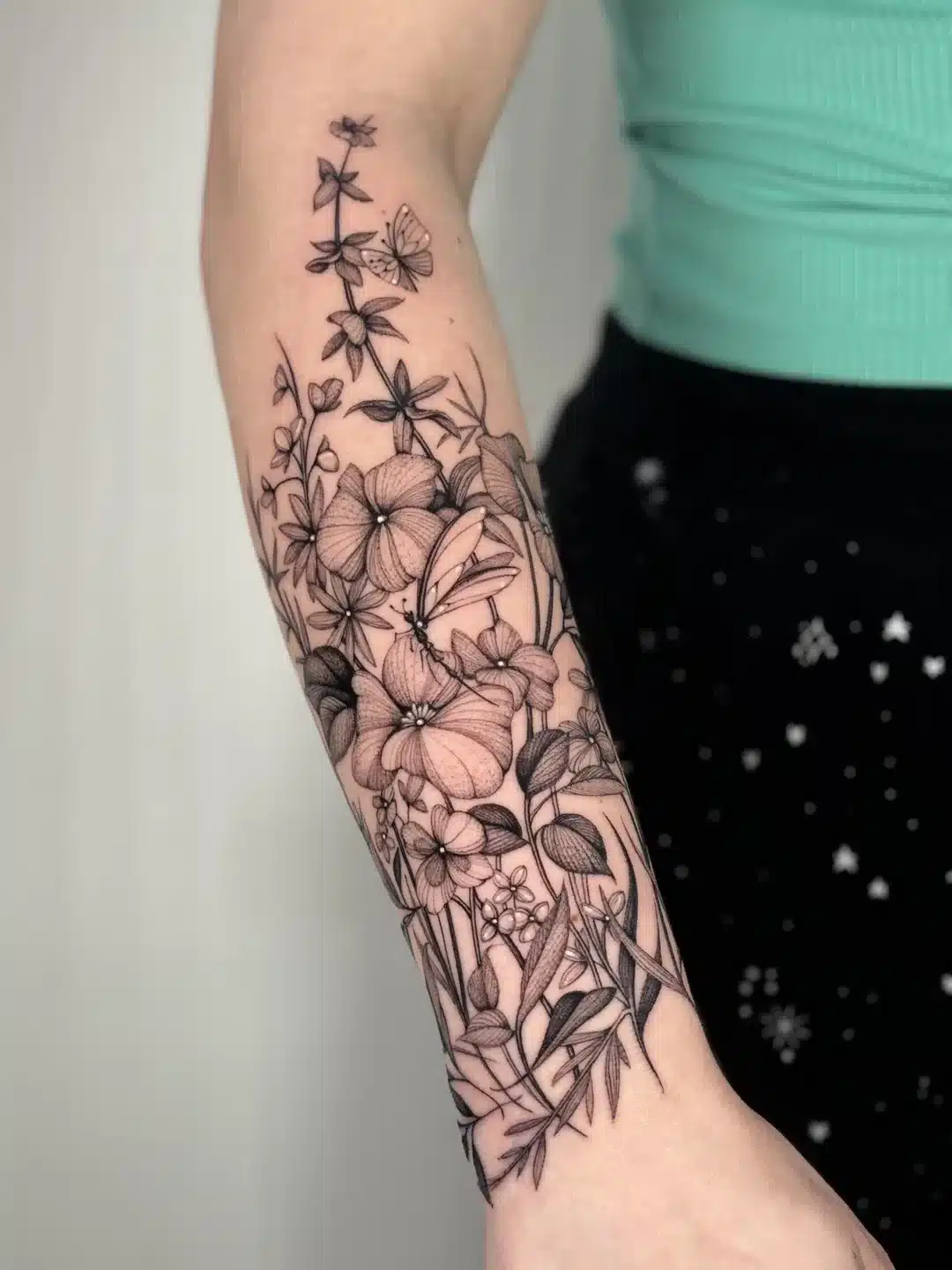 inspired design forearm tattoo