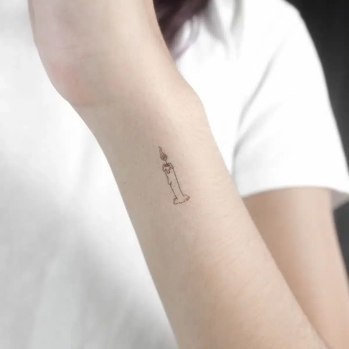 small flame tattoo