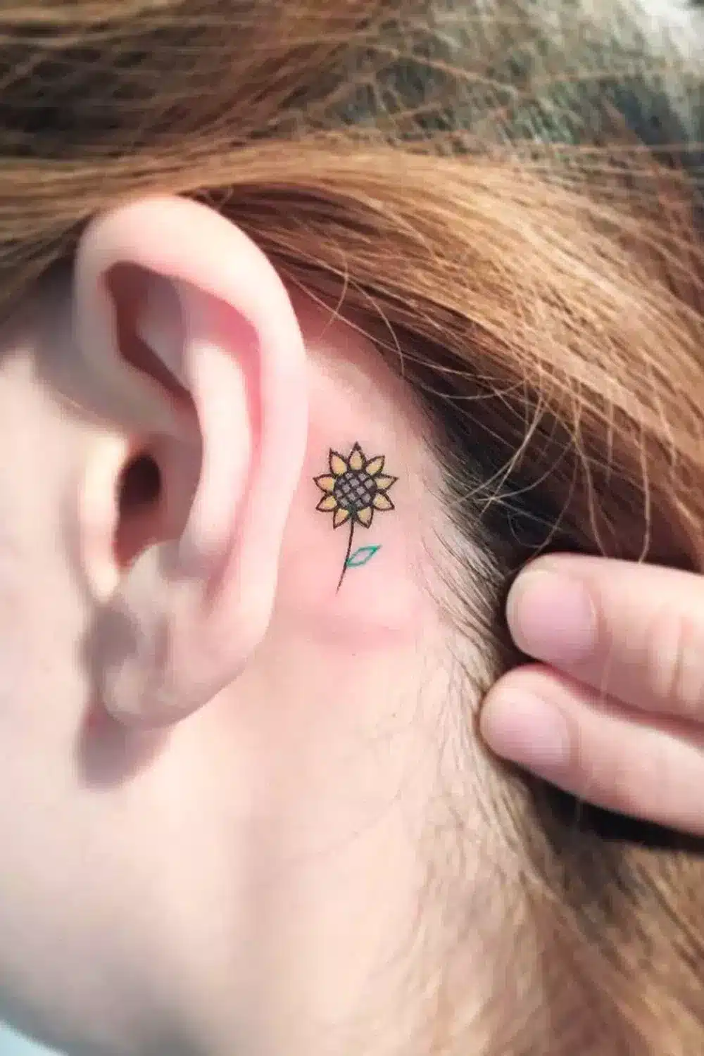 Flower ear tattoo